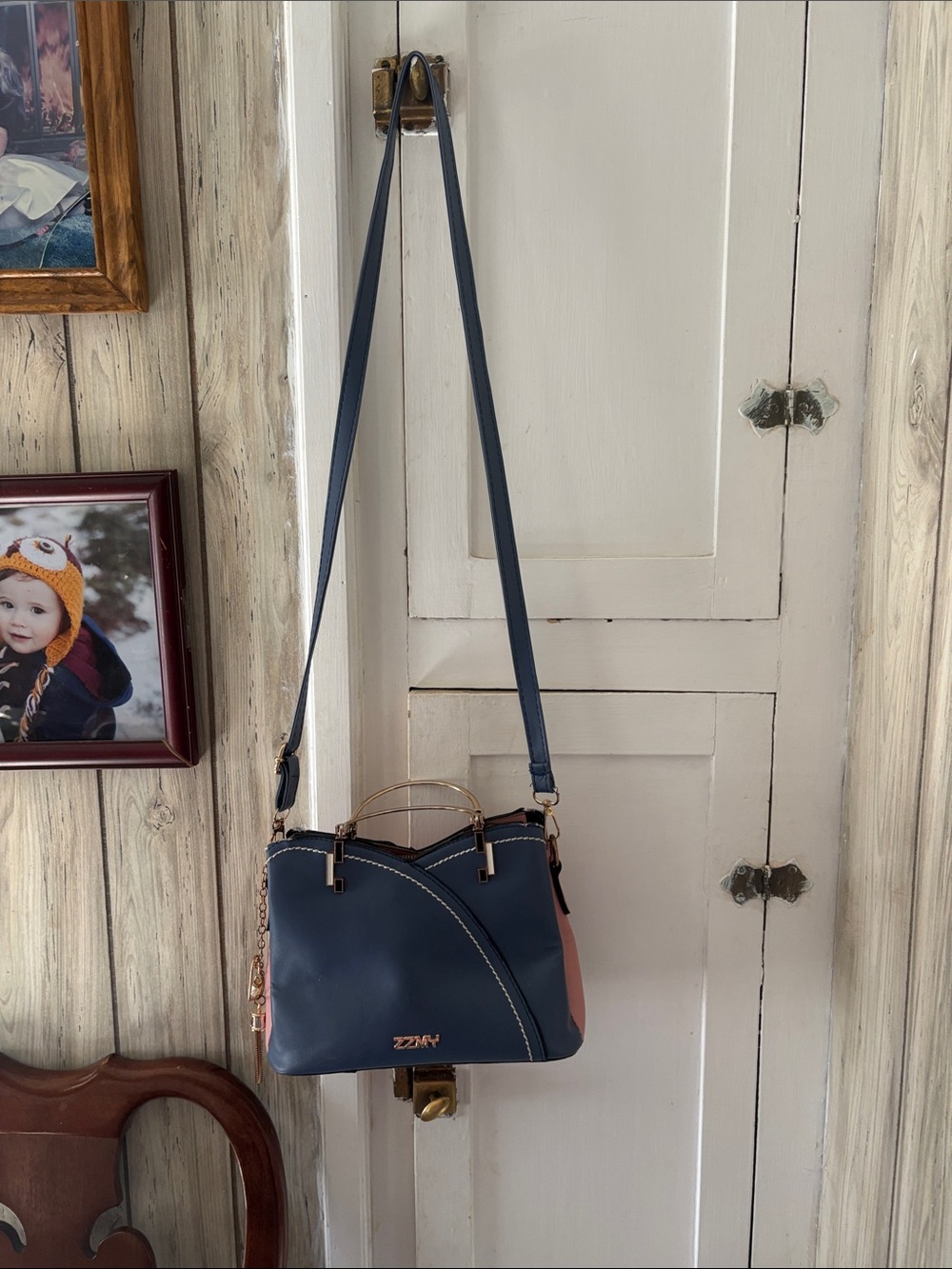 Elegant Navy and Pink Crossbody Bag with Gold Accents
